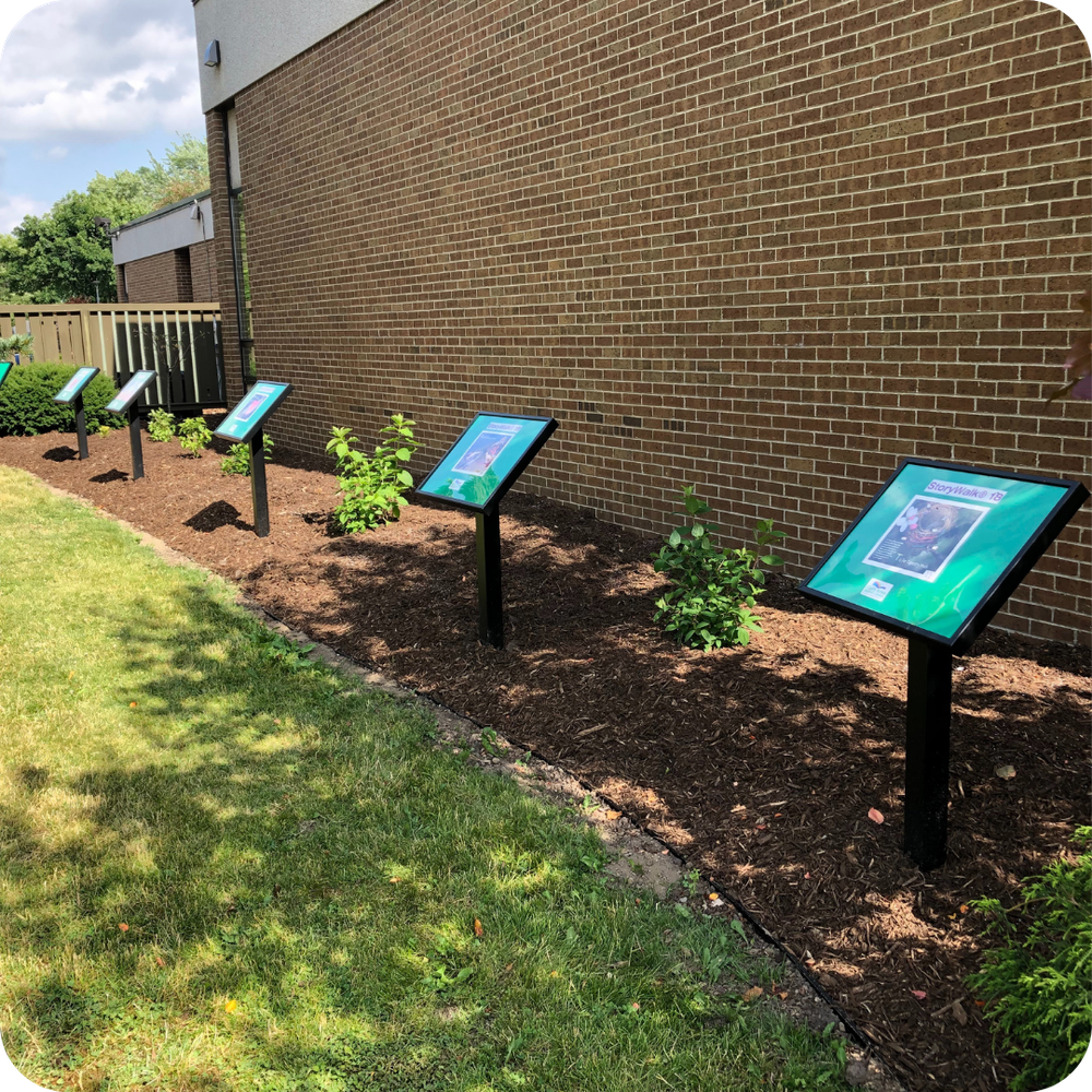 View of StoryWalk® displays along the side of a building